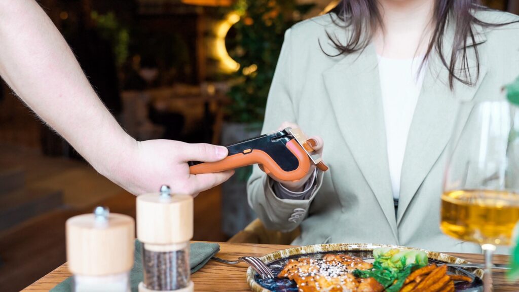 full service restaurant payment terminal server taking card at table