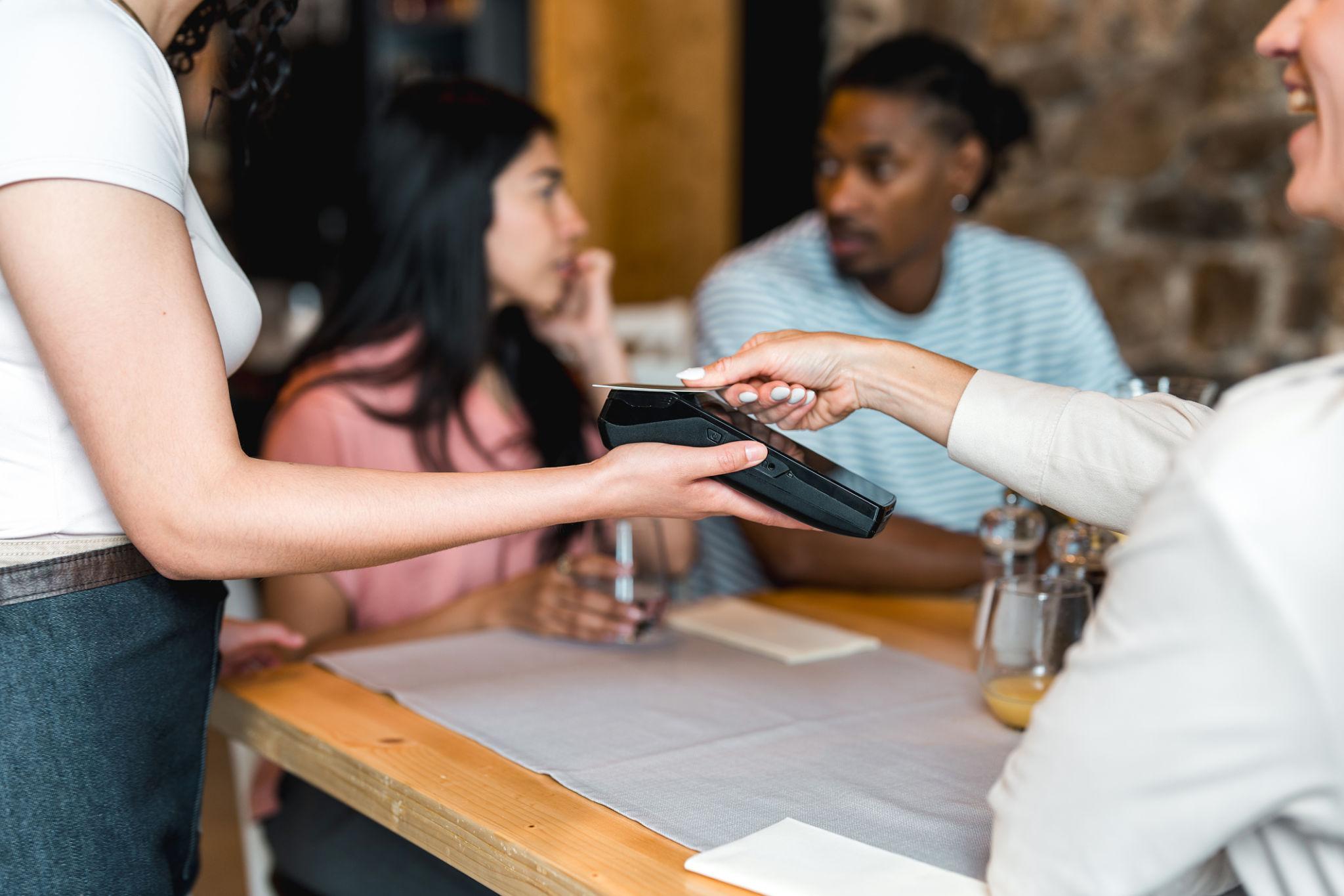 Merchant accepting a payment at checkout