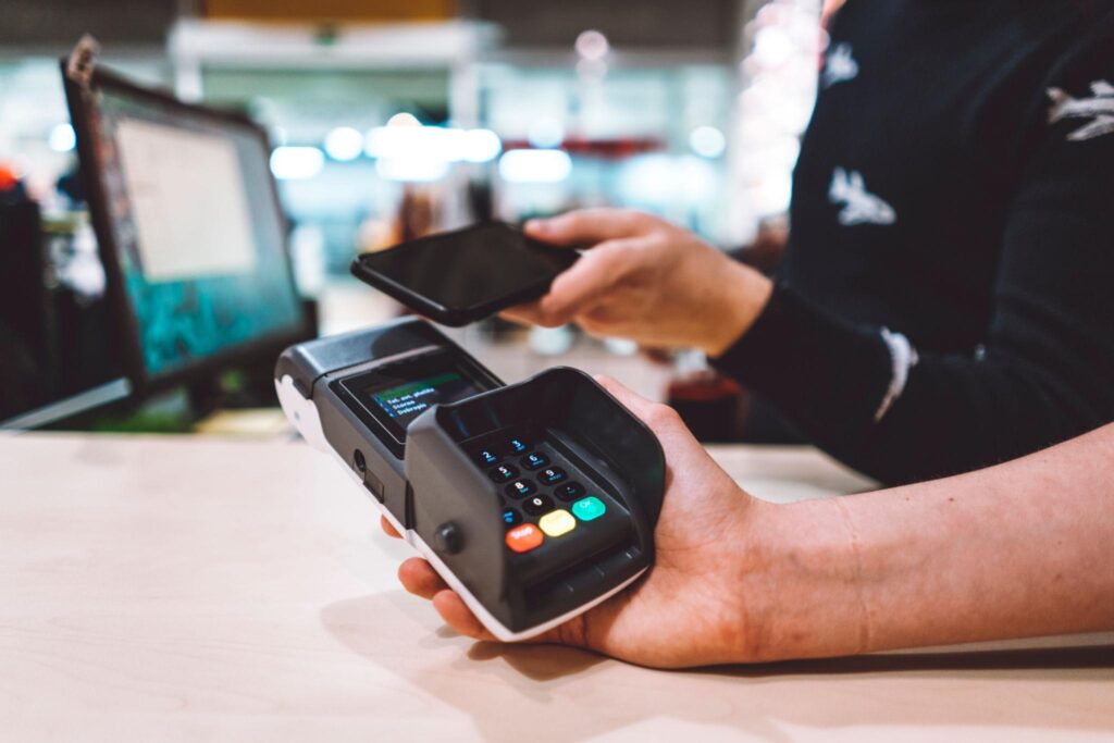 mobile retail payment processing tap to pay on smartphone at pop up shop