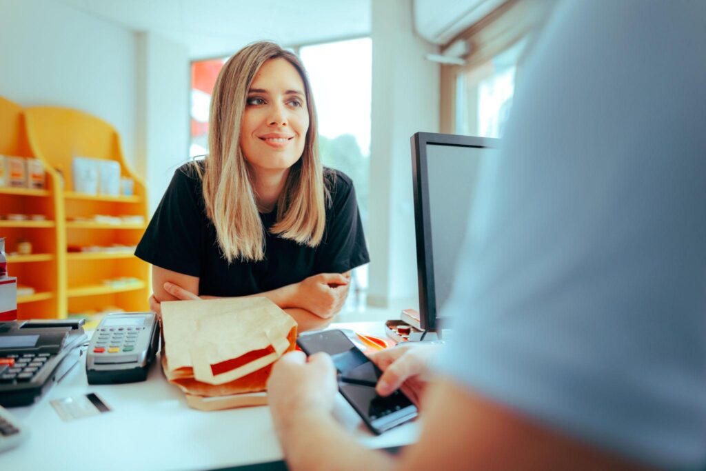 retail store checkout POS customer paying with card at counter