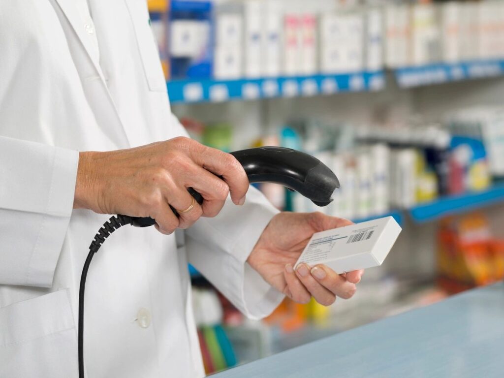 pharmacy payment processing customer paying at checkout counter